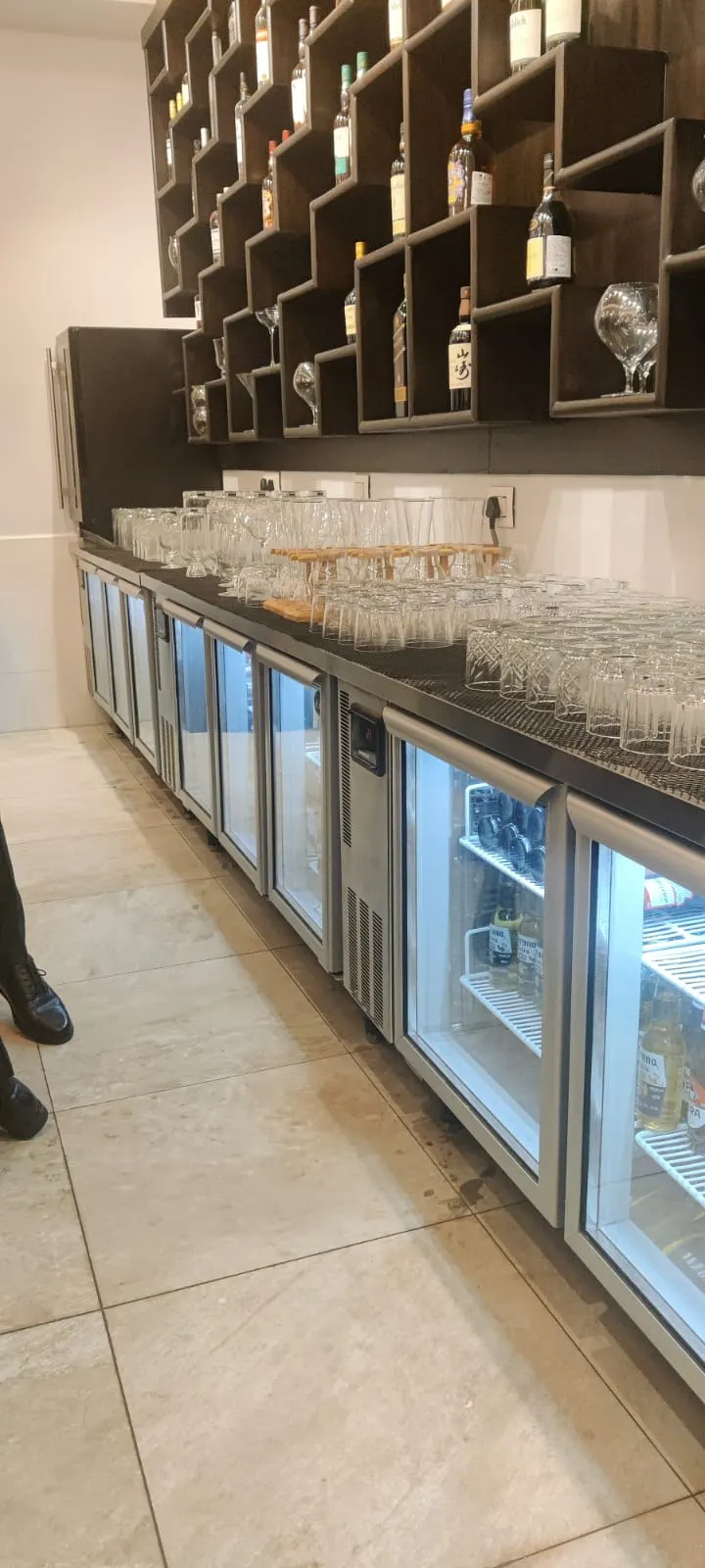 Glass door back bar chillers under a bar counter