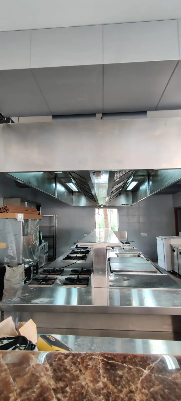 Island exhaust hood viewed from the service counter